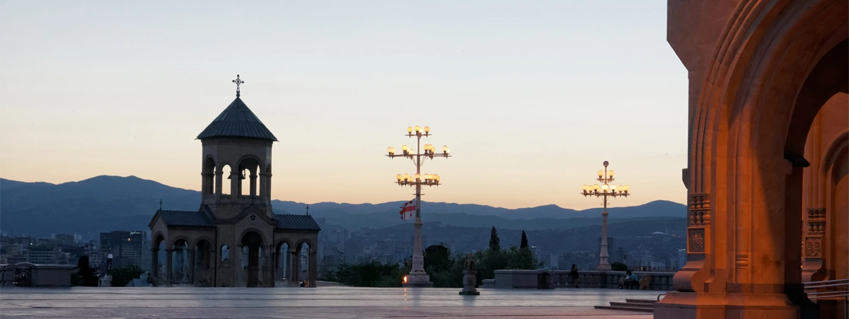 This photo shows the bell tower and courtyard of the Holy Trinity Cathedral of Tbilisi (also known as Sameba) in Tbilisi, Georgia